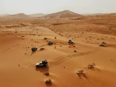 An overlanding camp in the desert dunes of Oman