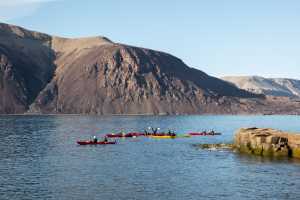 Kayaking along an arctic fjord