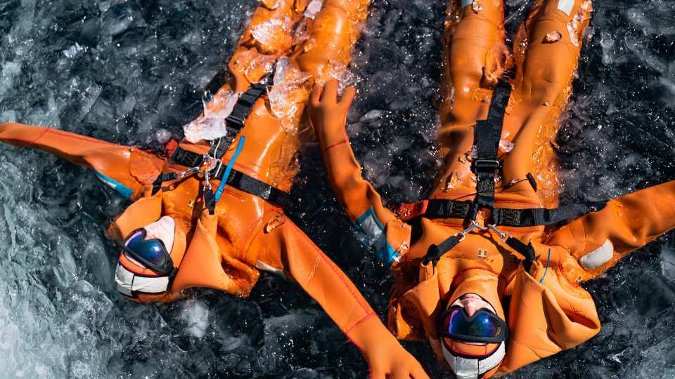 Nordic-inspired ice-floating in insulated dry suits on Lac de l'Ouillette