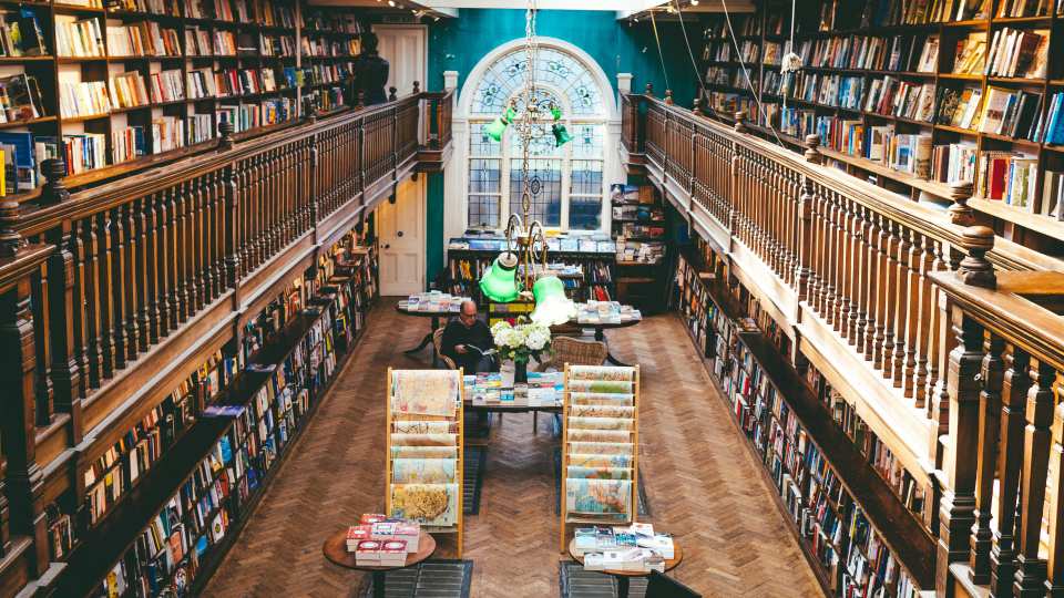 Shelves of books at Daunt Books in London