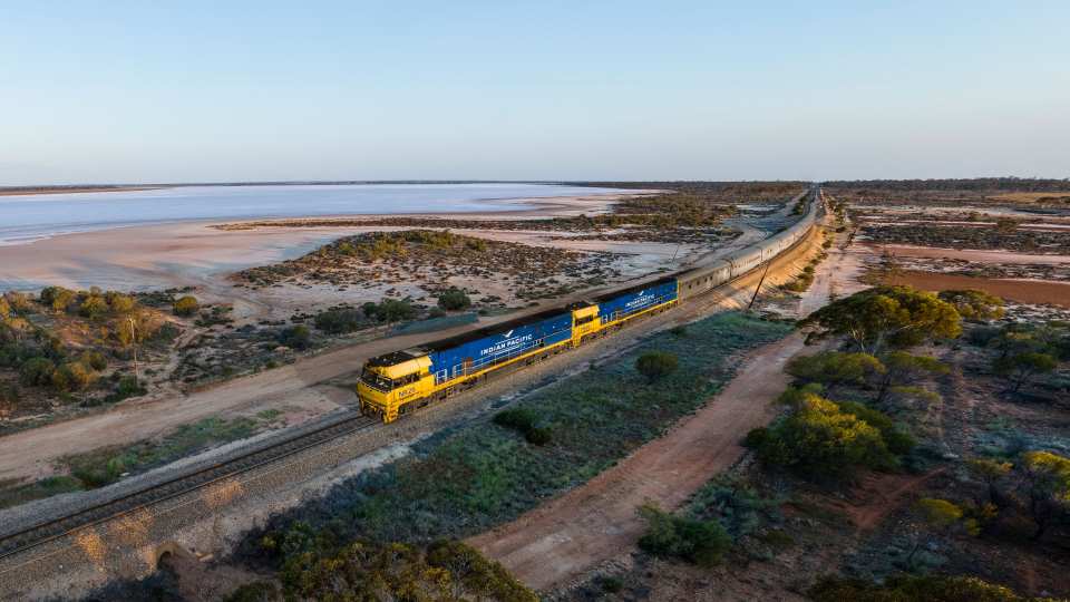 The Indian Pacific passing Lake Julia, in Western Australia