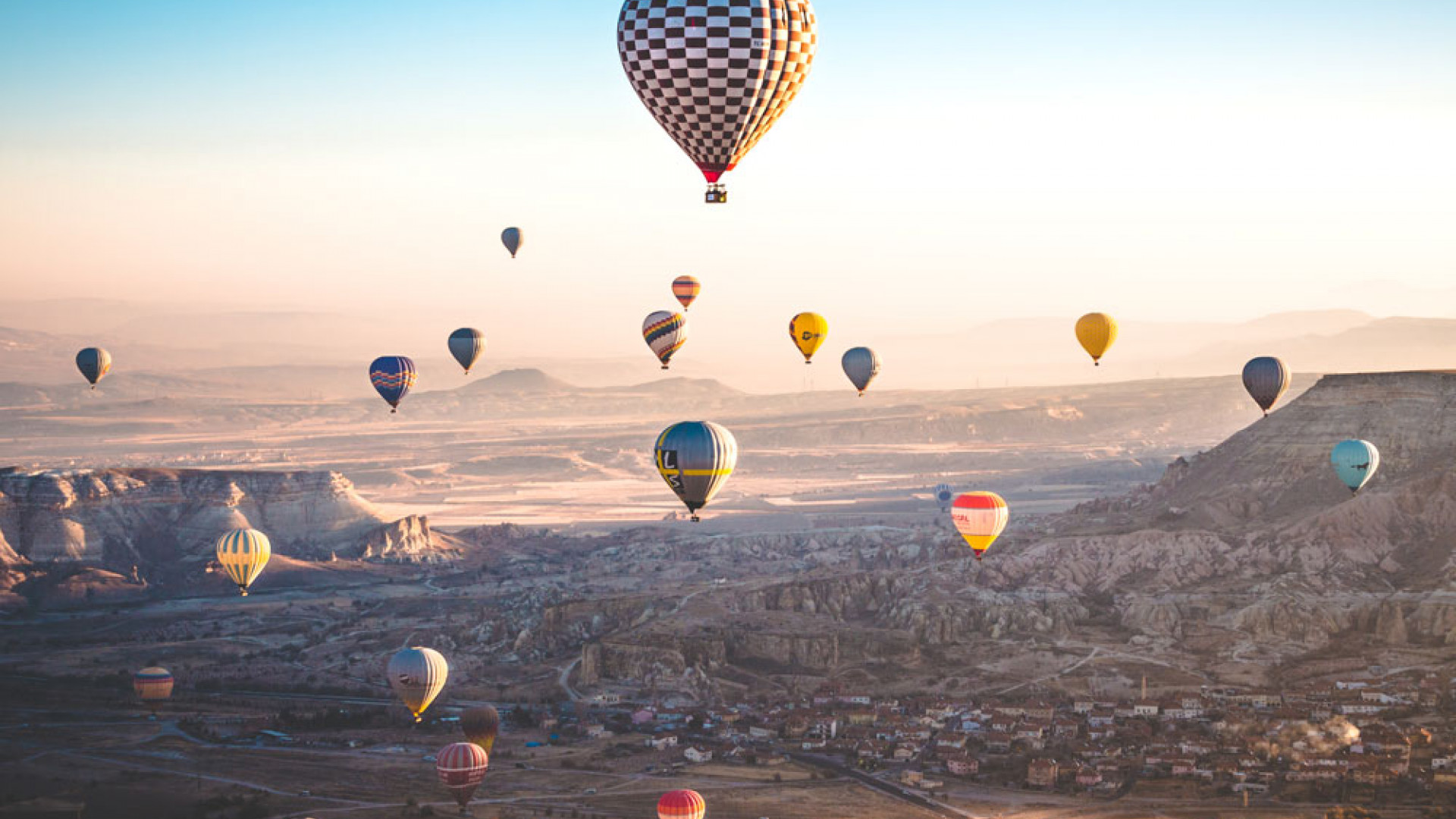 Hot air balloons flying over Cappadocia, Turkey Hot air balloons flying over Cappadocia, Turkey