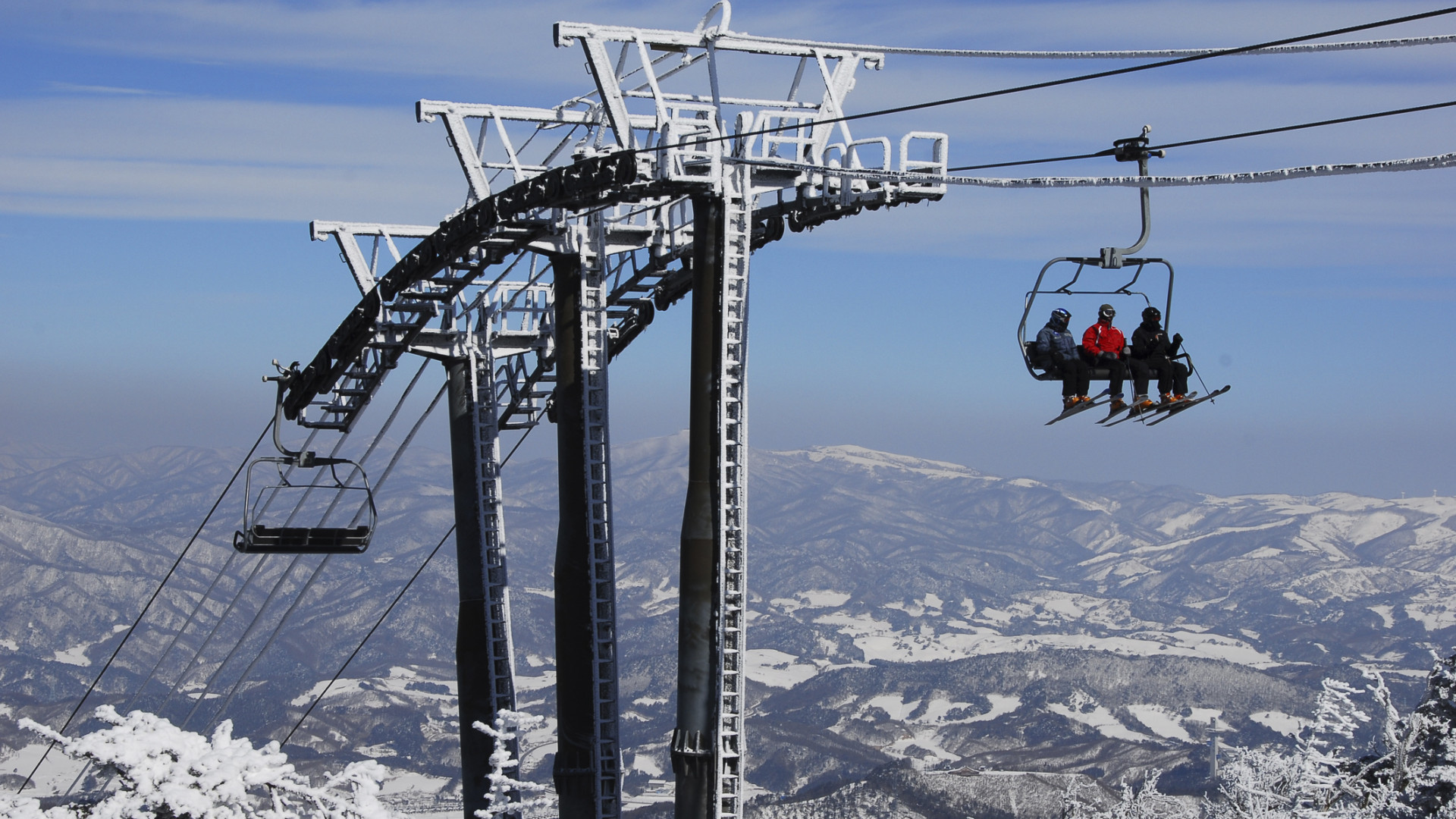 Skiiers on a lift a Yongpyeong, a resort which will likely see a boom after the Olympics in 2018