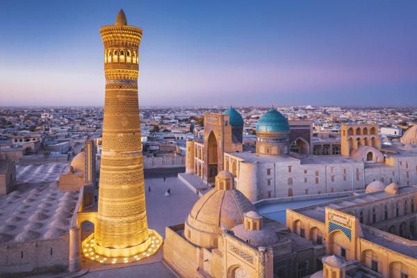 The sun sets on the Kalyan Minaret and Miri Arab Madressa in Bukhara