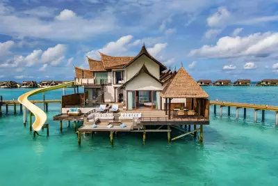 An over-ocean villa with a slide