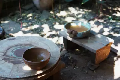 Throwing a bowl at Laos Pottery House