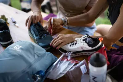 Installing the all-important sand gaiters on running shoes