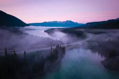 Morning mist rises from the surface of Emerald and Spirit Lakes