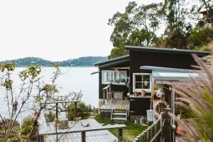 The Little Black Shack in Mackerel Beach, Australia The Little Black Shack in Mackerel Beach, Australia