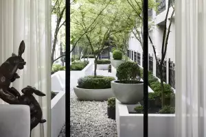 The interior courtyard at The Lyall Hotel, with a rabbit sculpture in the lobby The interior courtyard at The Lyall Hotel, with a rabbit sculpture in the lobby