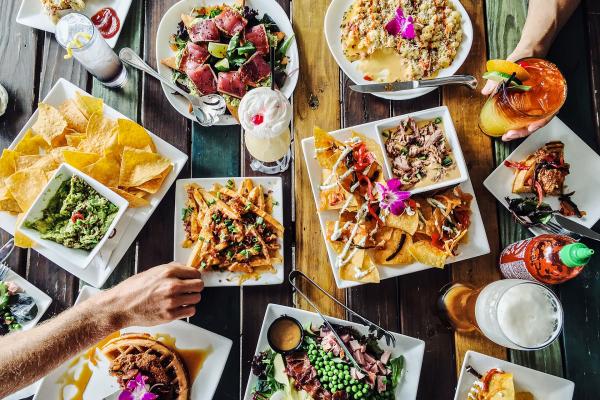 Food and drinks on a multicoluored wooden table