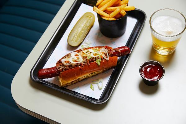 Mollie's cheese dog with cheese sauce and chipotle mayo
