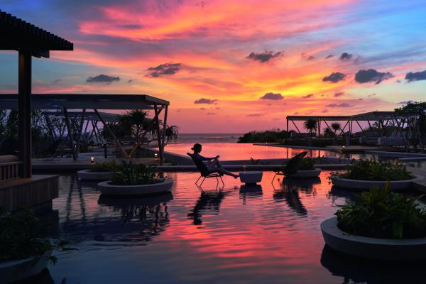 Swimming pool at sunset at Hoshinoya Okinawa
