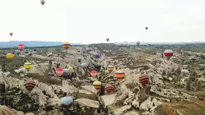 Hot air balloons over mountains in Turkey