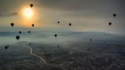 Hot air balloons over a city