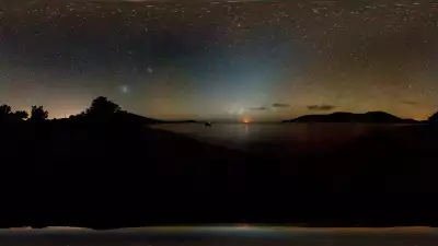 Photograph of beach under Milky Way stars at night in New Caledonia