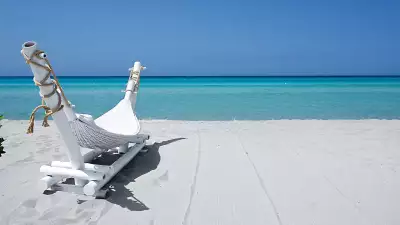 Lounger on the beach, Puglia, Italy