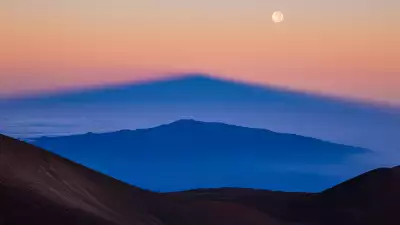 Shadow of Manua Kea projected over the volcano by the rising sun