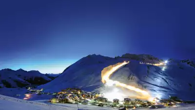 Innsbruck and the nearby mountains at night
