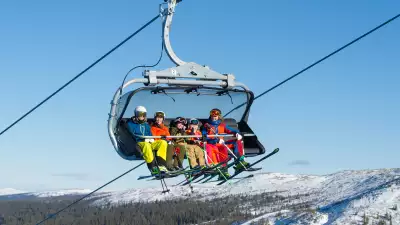 Family on a ski lift in Sweden