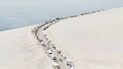 French mountain pass with cars and cycle race