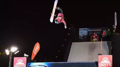 Snowboarder doing a backflip at the Telegraph Ski & Snowboard Show