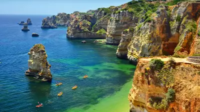 Kayaks and coastline in the Algarve
