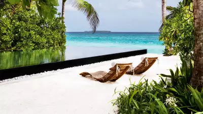 Infinity pool on the beach in the Maldives