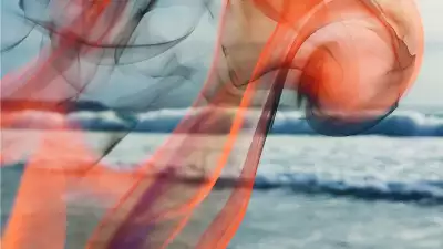 Swirling fire over the crashing waves of the sea