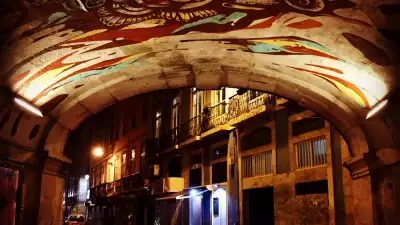 Brompton bike under street art archway