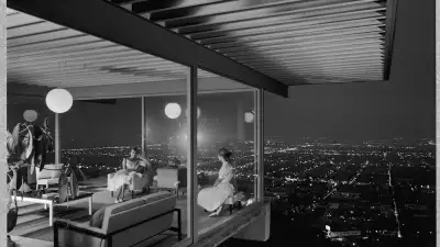 View through a glasshouse over the hills of LA, by Julius Shulman