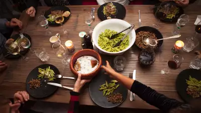 People dining at an event with VizEat meal hosting app