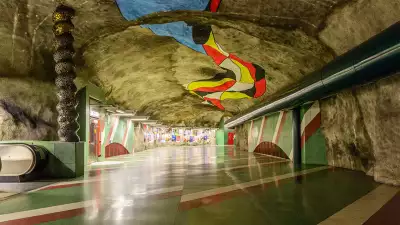 Colourful painted ceiling at Kungsträdgården metro station, Stockholm