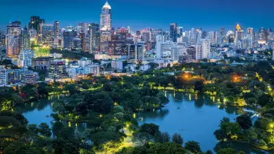Lumphini Park and the skyline of Bangkok , Thailand