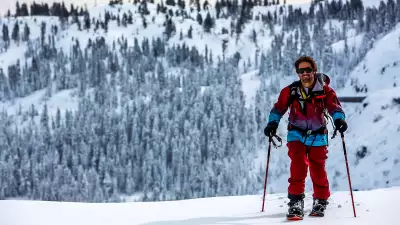Jeremy Jones splitboarding cross country to a run