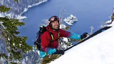 Jeremy Jones hiking to a run in the USA