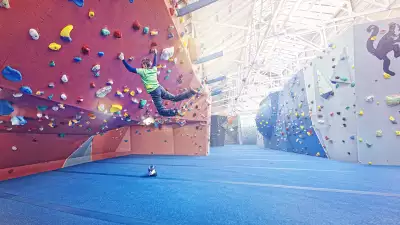 Climbing an overhang at The Arch climbing wall in Bermondsey