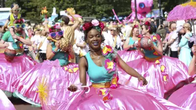 A colourful procession at Mouth of the Tyne festival