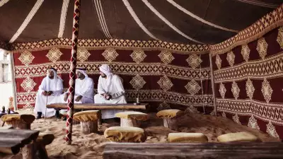 Three men in a traditional tent in Dubai