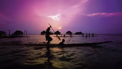 A canoe padler at sunset