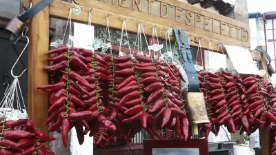 Strings of piment d'Espelette on sale in the French Basque Country