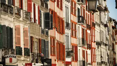The shuttered windows of a street in central Bayonne, French Basque country