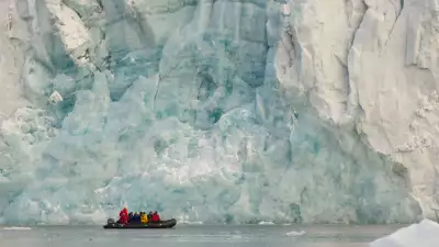 Zodiac in front of the Samarinbreen Glacier, Hornsund, Spitsbergen Island, Svalbard Archipelago, Norway