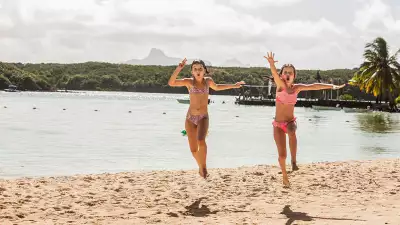 Kids on the beach at Beachcomber resorts