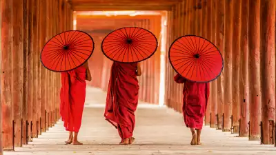 People walking with umbrellas in Myanmar