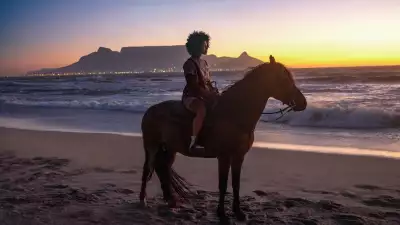 Riding a horse on a beach in South Africa