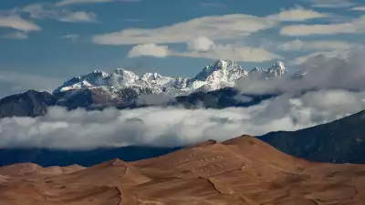 The Great Sand Dunes in Colorado with mountainous backdrop