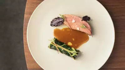 Pork shoulder steak, cabbage stuffed with alheira and roasted ham jus