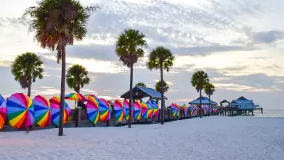 Pier 60 at sunset with its trademark rainbow-coloured umbrellas