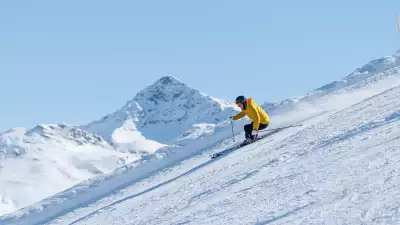 A skier glides down the mountain